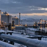 Illustration of a European LNG terminal and gas-storage facility in winter as Europe faces low stocks and high energy prices.