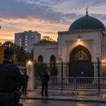 Illustration of French police securing a closed mosque near Paris after government action against its operating association.