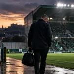 Illustration of a football manager leaving a stadium dugout after his dismissal.
