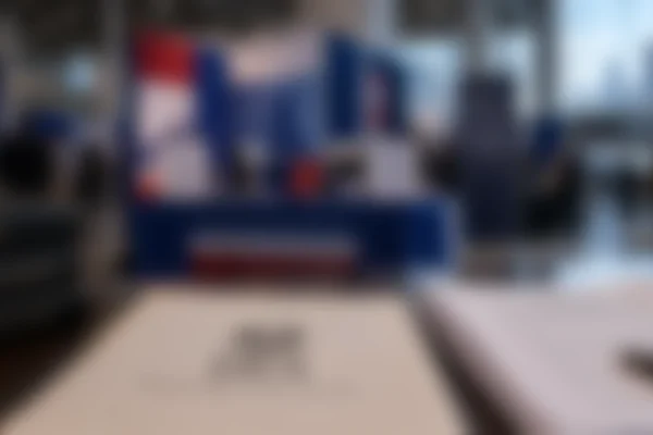 Atmospheric illustration of a convention exhibition hall representing questions over political campaign activity at a tax-exempt organisation's event.