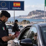 Illustration of Italian police carrying out Schengen border checks on travellers arriving from Spain following security concerns linked to Ceuta.
