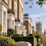 Editorial illustration of high-value London homes with Westminster in the distance, representing discussion of a lower property-surcharge threshold.