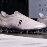 Editorial illustration of football boots and product-development materials representing On's expansion into football.