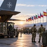 Illustration of a NATO airbase handling military equipment as European allies increase defence spending and diversify procurement.