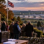 Illustration of residents voting in an Oxfordshire village with a proposed large accommodation site visible nearby.