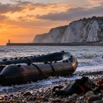 AI-generated editorial illustration of an abandoned small boat on the Kent coast after reaching shore.