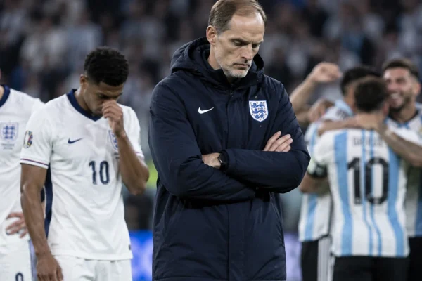 Illustration of Thomas Tuchel and dejected England players after their World Cup semi-final defeat to Argentina.